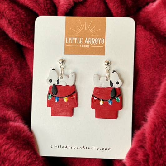 Dog atop Doghouse with Christmas Lights